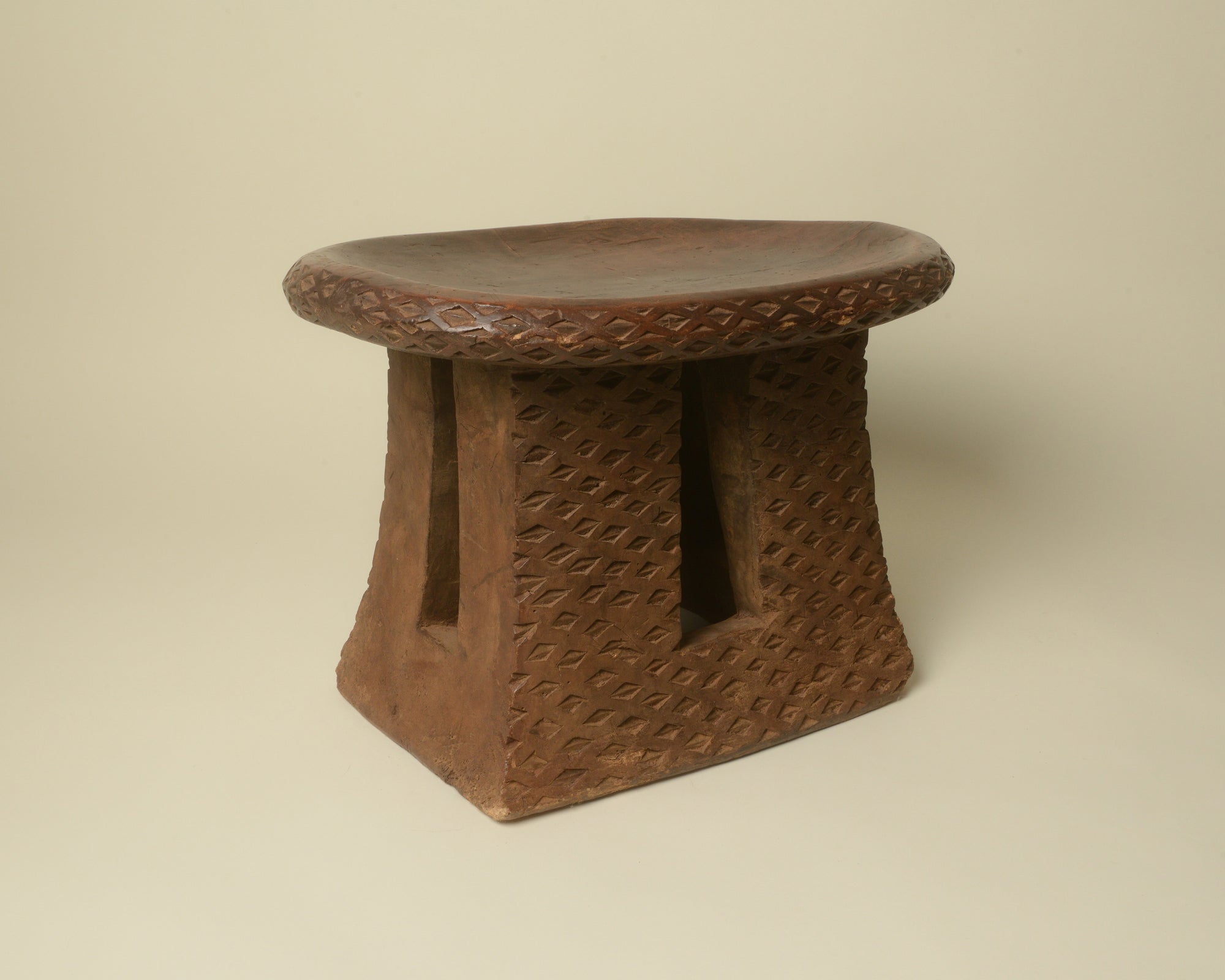 Hand-carved Bamikele stool from Cameroon.
