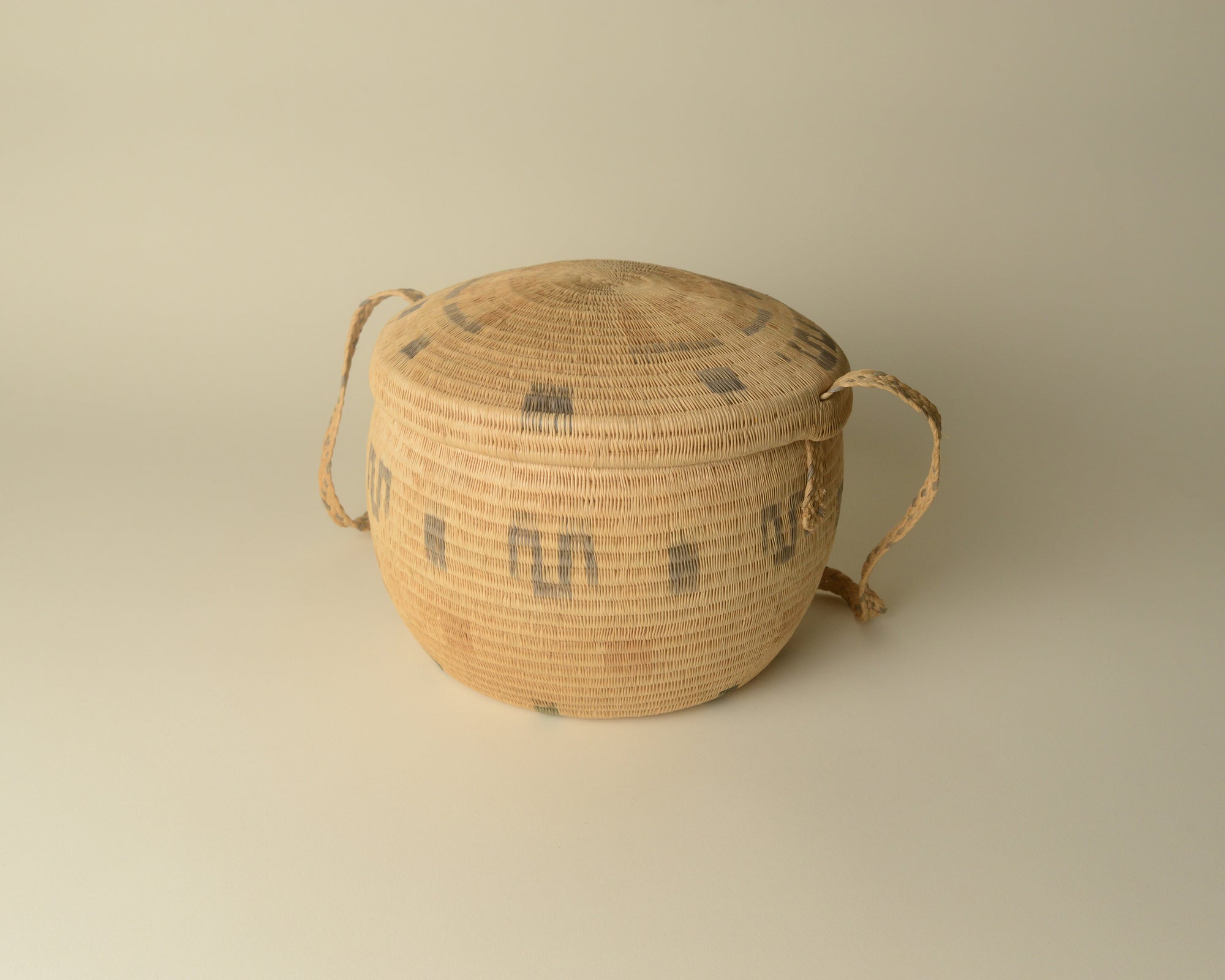 Woven Venezuelan basket with sliding lid.