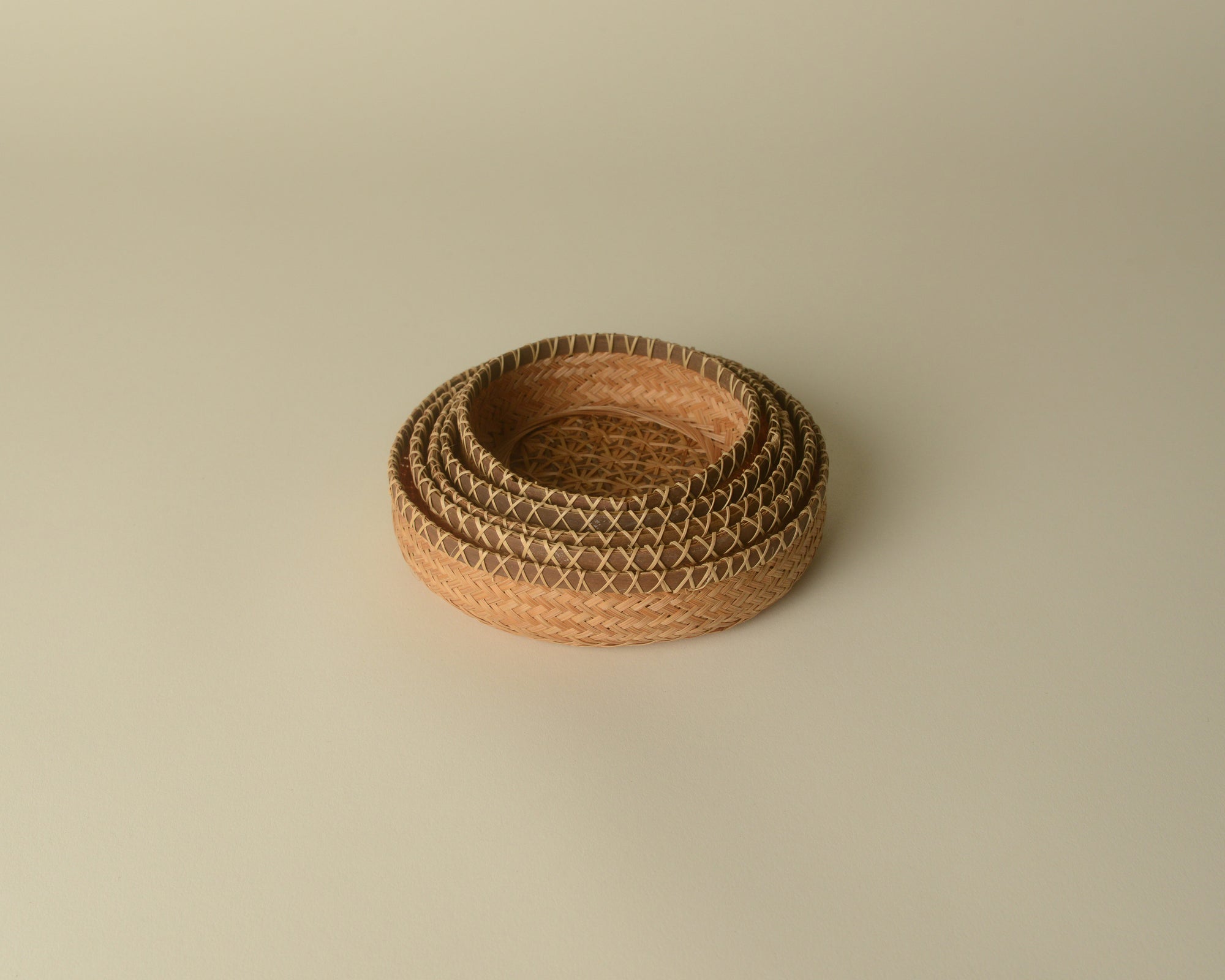 Set of nested woven trays from Southeast Asia.