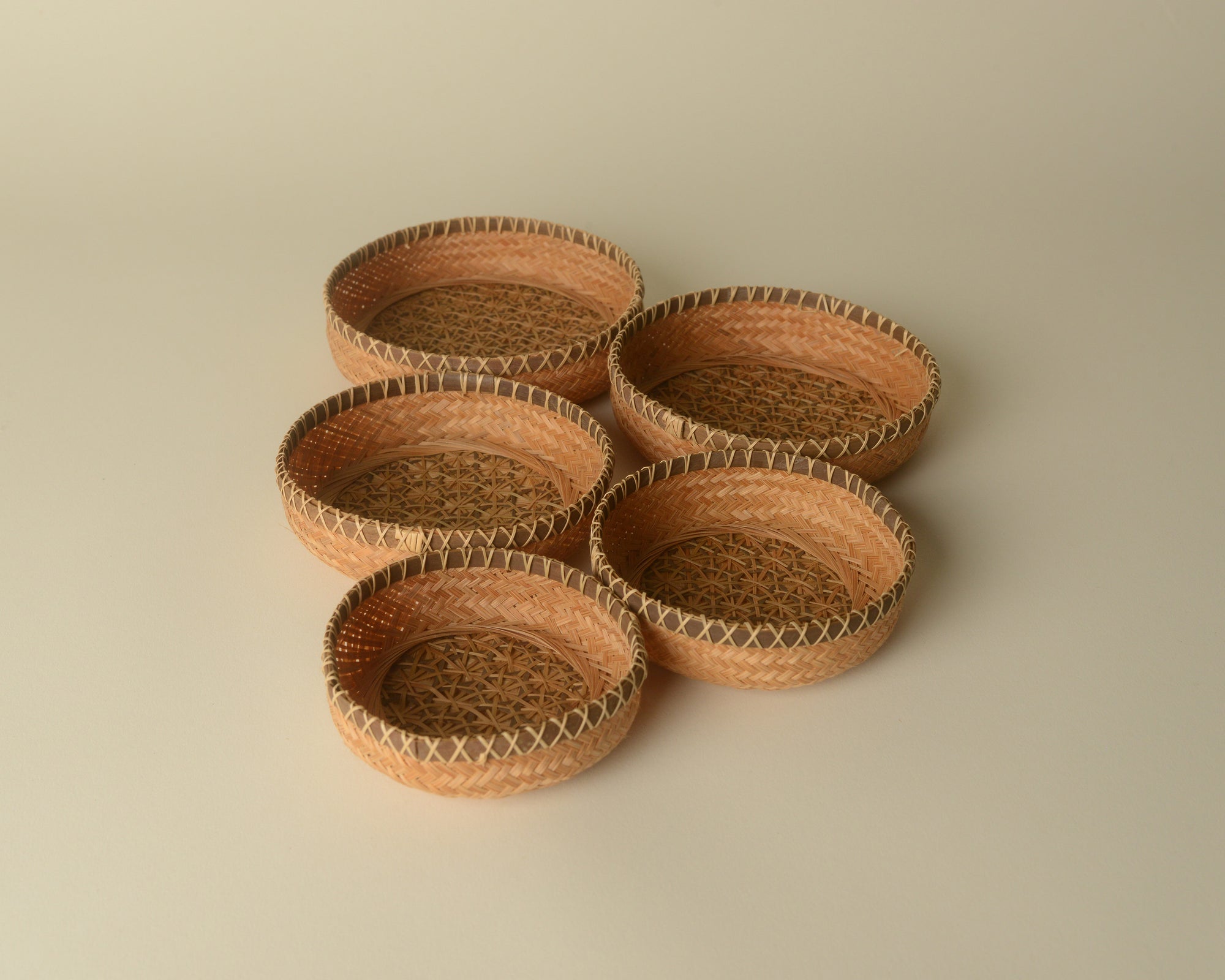 Set of nested woven trays from Southeast Asia.