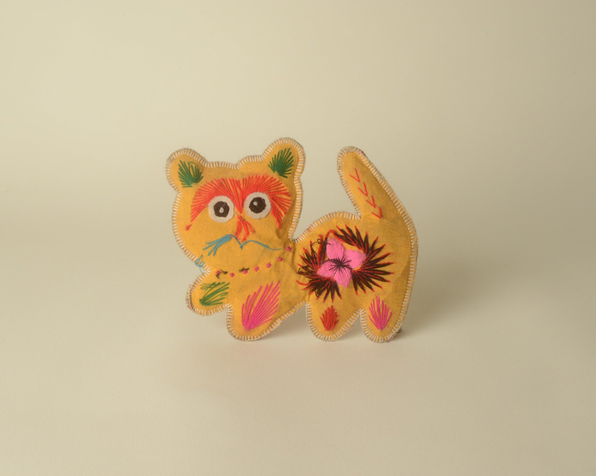 Double-sided embroidered cat cushion, China.