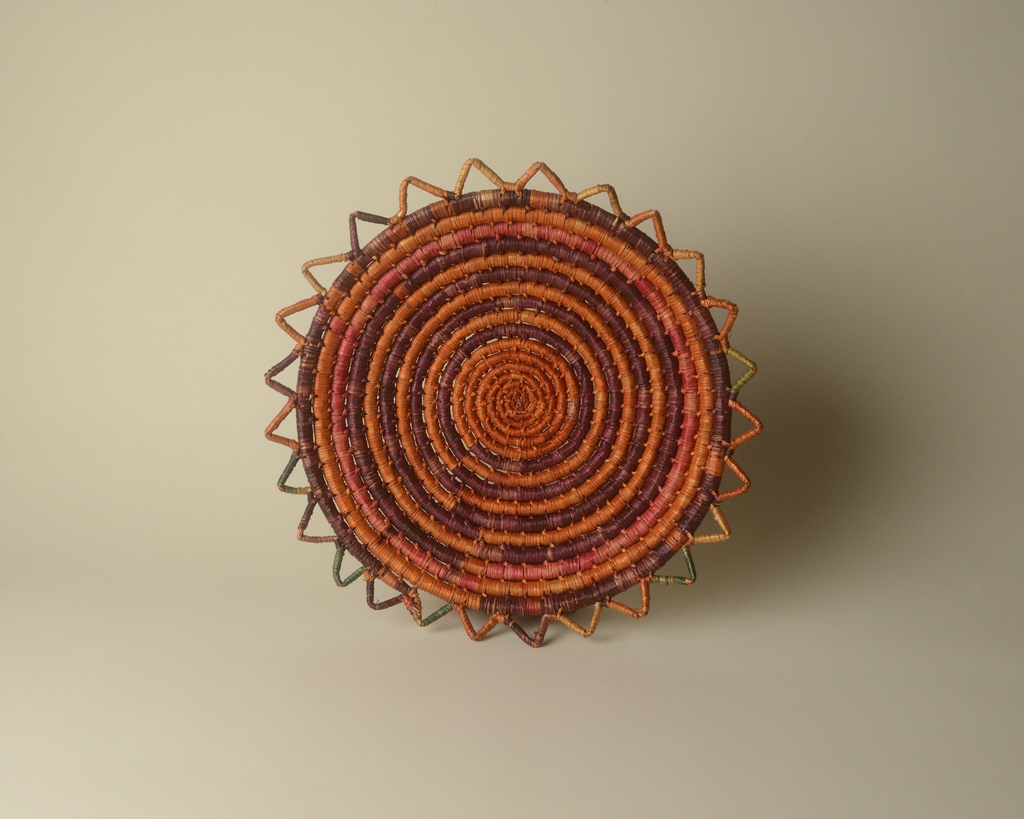 Sun-shaped coiled seagrass platter.