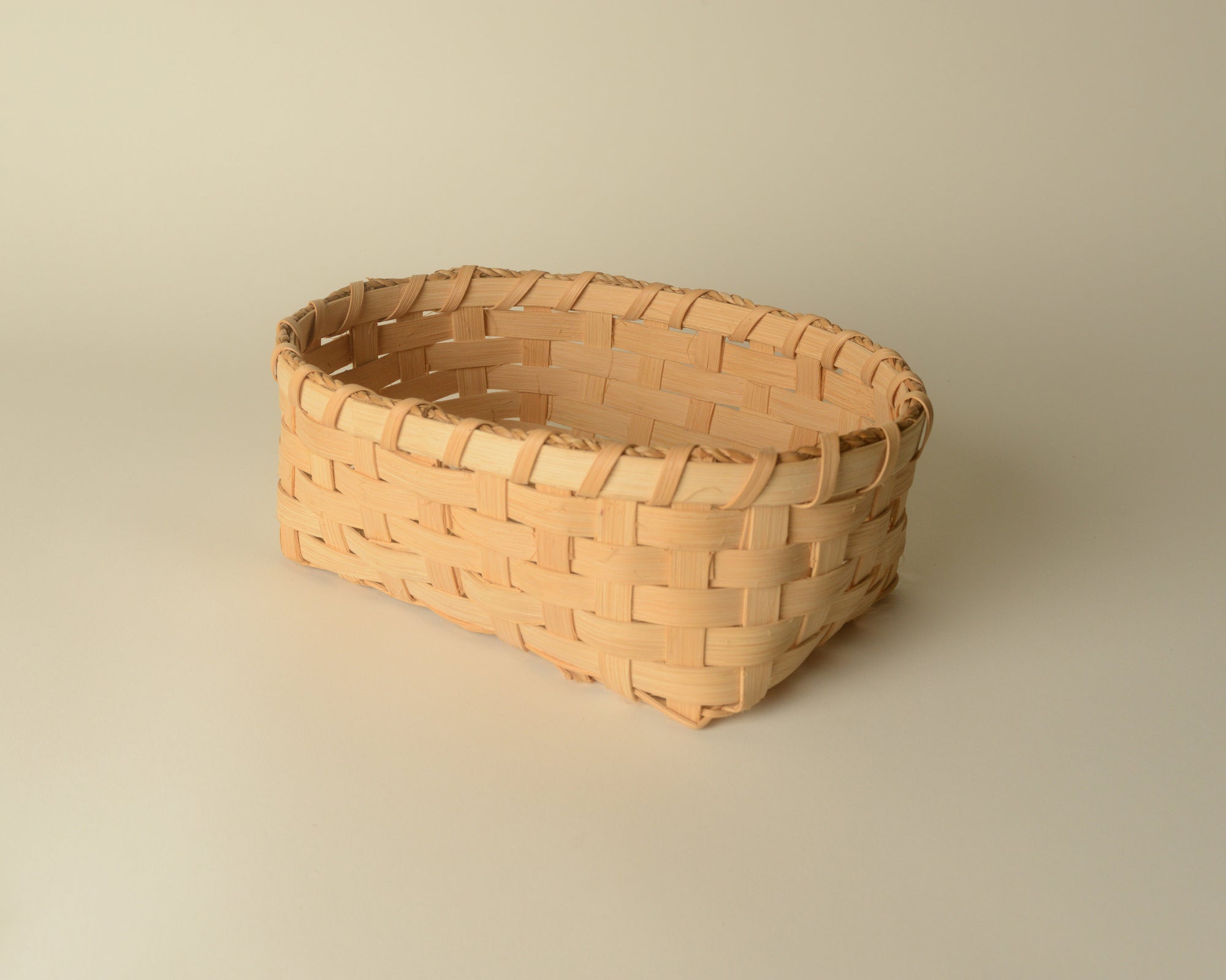 Handwoven maple reed bread basket.